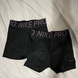 two pairs of nike pros